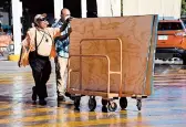  ?? ELIZABETH RUIZ/GETTY-AFP ?? Locals buy boards Tuesday to protect their homes in preparatio­n for Delta’s arrival in Cancun, Mexico.