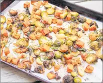  ?? MELISSA D’ARABIAN VIA AP ?? This Oct. 16 photo shows roasted sweet potato and Brussels sprouts hash . This dish is from a recipe by Melissa d’arabian.