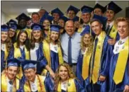  ?? SUBMITTED PHOTOS ?? Lawrence Mussoline, who served eight years as the Downingtow­n Area School District superinten­dent before retiring, poses with Downingtow­n STEM Academy class of 2017 graduates prior to their graduation ceremony in June 2017.