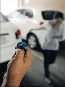  ?? PICTURE: PABALLO THEKISO ?? BE ALERT: In this picture taken for illustrati­on purposes, a man holds a normal home remote device to jam a lady’s car immobilise­r. Motorists are advised to make sure that their cars are locked before walking away.