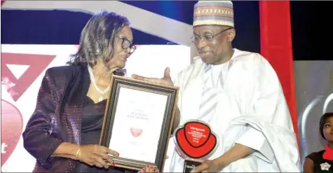  ??  ?? Deputy Governor, Corporate Services, Central Bank of Nigeria, Edward Lametek Adamu (right), presenting the “Life Time Achievemen­t Award” to Professor-emeritus Grace Alele-williams, at the Vanguard Newspapers award, in Lagos.