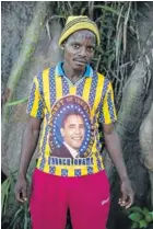  ??  ?? YES I CAN: A member of the anti
balaka shows off a Barack Obama T-shirt. The
militia group goes from village to village in
search of Muslims to
massacre