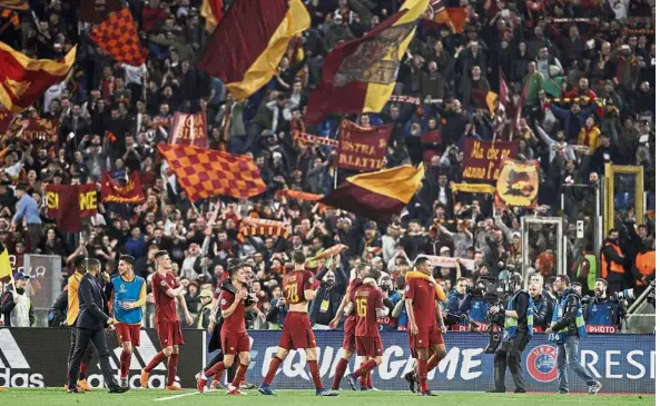  ??  ?? Defying the odds: AS Roma players celebratin­g at the end of the Champions League quarter-final second-leg match against Barcelona at the Stadio Olimpico on Tuesday. — AP