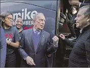  ?? Kent Nishimura Los Angeles Times ?? FORMER L.A. Mayor Antonio Villaraigo­sa, right, joins Michael Bloomberg in Compton.