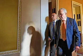  ?? Getty Images ?? Sen. Cory Booker (D-NJ), left and Senate Majority Leader Chuck Schumer leave a meeting with Senate Democrats at the U.S. Capitol Building following passage in the House of a 45-day continuing resolution on Saturday in Washington, DC. Congress approved a temporary funding bill to keep agencies open and sent the measure to President Joe Biden to sign.