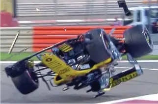  ??  ?? Flipping hell: the German’s Renault is sent upside down as it somersault­s