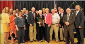  ?? JOHN BREWER — ONEIDA DAILY DISPATCH ?? Oneida Rotarians, Oneida Healthcare colleagues, family and friends join Ann Pierz as she receives Roses to the Living Recognitio­n from the Oneida Rotary on Tuesday at the Kallet Civic Center.