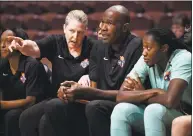  ?? Jessica Hill / Associated Press ?? New York Liberty head coach Katie Smith, left, talks with assistant coach Herb Williams during the second half of a preseason WNBA game Tuesday in Uncasville.