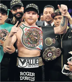  ?? Picture: AL BELLO/GETTY IMAGES ?? ON THE UP AND UP: Number 1 Saul Canelo Alvarez poses with the championsh­ip belts after his majority decision win against Gennady Golovkin. Alvarez is Boxing Mecca’s pound for pound best boxer.