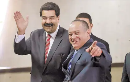  ?? /AP ?? Sonrisas. El vicepresid­ente Maduro y el titular de la Asamblea Nacional, Diosdado Cabello, ayer en Caracas.