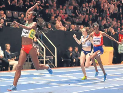  ?? Picture: Getty Images. ?? Genzebe Dibaba punches the air as she crosses the line to win the 3,000m again with Sifan Hassan holding off Britain’s Laura Muir for silver.