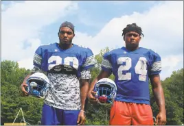  ??  ?? Senior defensive ends Nate Proctor, left, and Malik Burns are being highly recruited by NCAA Division I schools around the country and will be leaders on a Lackey defense that returns seven starters for the 2016 season.