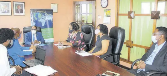  ??  ?? State minister in the Ministry of Industry, Investment and Commerce Dr Norman Dunn (at head table) addresses staff of the Jamaica Intellectu­al Property Office in Kingston last week.