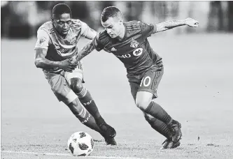  ?? CANADIAN PRESS FILE PHOTO ?? Toronto FC’s Sebastian Giovinco, right, moves past Seattle Sounders FC’s Kelvin Leerdam in Major League Soccer action in Toronto on May 9.