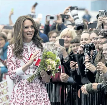  ?? JONATHAN HAYWARD/THE CANADIAN PRESS ?? The Duchess of Cambridge greets well-wishers upon her arrival Sunday in Vancouver.