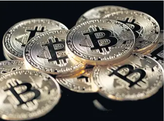  ?? REUTERS ?? Bitcoin, a cryptocurr­ency, has different characteri­stics than a digital token.