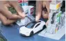  ?? PHOTO: REUTERS ?? Matchbox's Tesla Roadster diecast toy, made from recyclable materials.