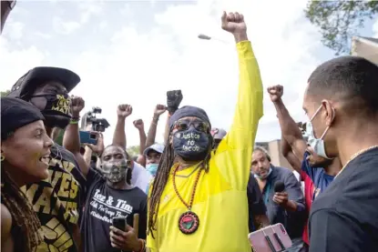  ?? ASHLEE REZIN GARCIA/SUN-TIMES PHOTOS ?? Justin Blake, Jacob Blake’s uncle, marches Thursday with Black Lives Matter protesters outside Grace Lutheran Church in Kenosha, while Democratic presidenti­al candidate Joe Biden was inside meeting with community members.