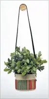  ??  ?? Small natural canvas hanging planter by Good Company Wares, $34, beinggood company.com.