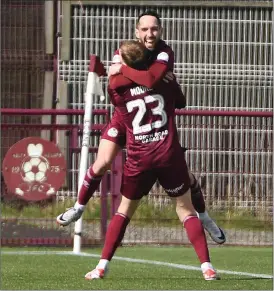  ?? ?? Goalscorer Stefan McCluskey hitches a celebrator­y lift from Lewis Moore