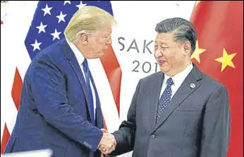  ?? AFP FILE ?? US President Donald Trump with Chinese President Xi Jinping. China will suspend the planned addition of 10% and 5% tariffs on some US imports.