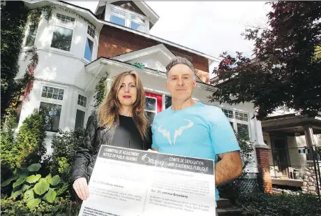  ?? PATRICK DOYLE ?? Litsa Karamanos and her husband Hassan Moghadam said they hired high-end profession­als to design and site their home on Broadway Avenue in the Glebe, but it wasn’t enough to avoid the ire of neighbours, who raised $30,000 to fight the plan at the Local Planning Appeal Tribunal.