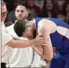  ?? DAVID J. PHILLIP/ ASSOCIATED PRESS ?? Kansas big man Hunter Dickinson suffered a dislocated shoulder during a game against Houston and was held out of the Big 12 Tournament.