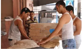  ?? ?? A 2010 photograph of Saj griddle bread, used as a base for chicken fatta, being made on the streets of the Rimal neighborho­od of Gaza City. Photograph: Maggie Schmitt/The Gaza Kitchen