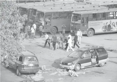  ??  ?? Scene of the bomb blast at Nyanya bus terminus in Abuja, Monday.