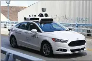  ?? THE ASSOCIATED PRESS ARCHIVES ?? Uber says it will bring self-driving cars back to San Francisco and Toronto when it gets the OK from the proper authoritie­s.