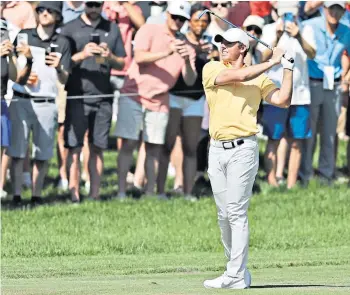  ?? ?? Swing demons: Rory Mcilroy looks on nervously after hitting from the fairway at the Memorial