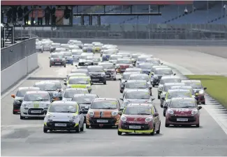  ??  ?? Nearly 100 Citroen C1s took part in the 24-hour race on the Silverston­e Grand Prix layout