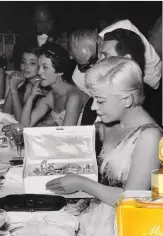  ??  ?? Italian actress Giulietta Masina opening the limited-edition of Diorissimo EDP at the 1956 Cannes Film Festival