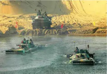  ?? PHOTOGRAPH: Indian Army ?? BMPs crossing water obstacle