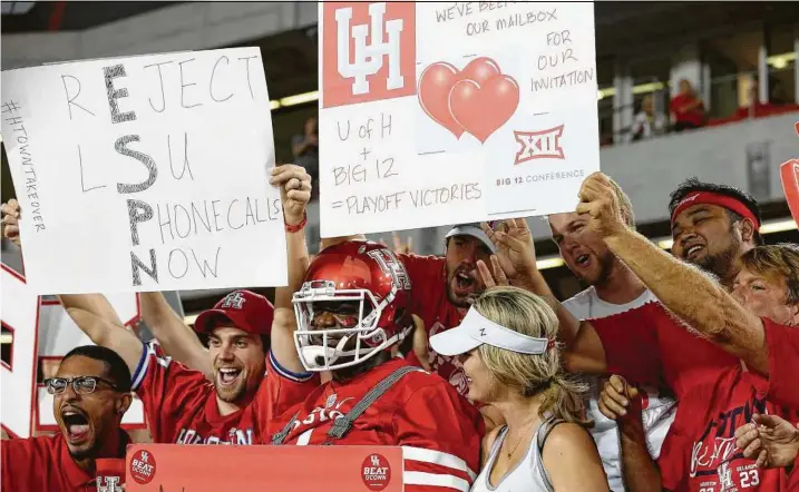  ?? Yi-Chin Lee / Houston Chronicle ?? University of Houston fans did not get the sign they were looking for when the Big 12 announced its decision.