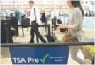  ??  ?? Passengers at DIA use the TSA PreCheck line. Denver Post file