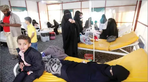  ??  ?? Yemeni cholera patients lie in bed at the Al-Sabeen hospital in Sanaa yesterday.