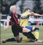  ?? Pictures by Tom Phillips ?? KNEE-SY DOES IT Fleetlands’ Phil Archbold, left, with Locks’ David Dunkley and, above right, Bryn McKie in possession for Fleetlands