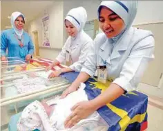  ??  ?? Nurses at Kangar Hospital in Perlis tending to newborns. Health DirectorGe­neral Datuk Dr Noor Hisham Abdullah says this year’s allocation is better than last year’s.