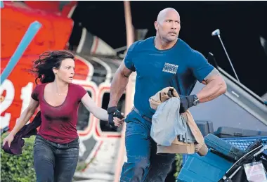  ??  ?? Can Dwayne Johnson and Carla Gugino outrun an earthquake in San Andreas?