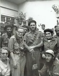  ??  ?? War photograph­er and Shorewood native Dickey Chapelle (second from left) poses with Maj. Antonio Lusson and a group of soldiers during the Cuban Revolution in this 1958 photo.