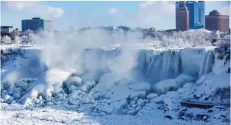  ?? | TARA WALTON CANADIAN PRESS ?? WATER flows over the frozen American Falls, seen from the Canadian side in Niagara Falls, Ontario this week.