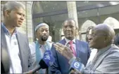  ?? PICTURE: THOMAS HOLDER ?? GIVE THEM CREDIT: Archbishop Emeritus Desmond Tutu, right, said Andile Lili, second from right, and Loyiso Nkohla, left, should be commended for calling off yesterday’s march to the city centre. Tutu was speaking after a service at St George’s Cathedral.