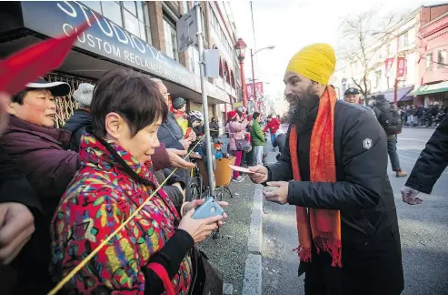  ?? DARRYL DYCK / THE CANADIAN PRESS ?? NDP Leader Jagmeet Singh, right, is facing a complex race in the Burnaby South byelection, with multiple opponents and simmering division over race, patriotism, sexuality, pipelines, housing affordabil­ity and more.