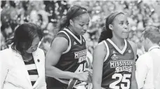  ?? MATTHEW EMMONS, USA TODAY SPORTS ?? Mississipp­i State players Chinwe Okorie, center, and Zion Campbell leave the court after their NCAA title-game loss.