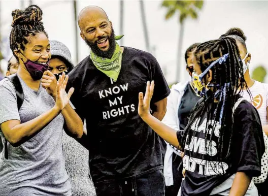  ?? MARCIO JOSE SANCHEZ AP ?? Rapper and actor Common attends a youth-led demonstrat­ion in Los Angeles in 2020 calling for an end to racial injustice and accountabi­lity for police.