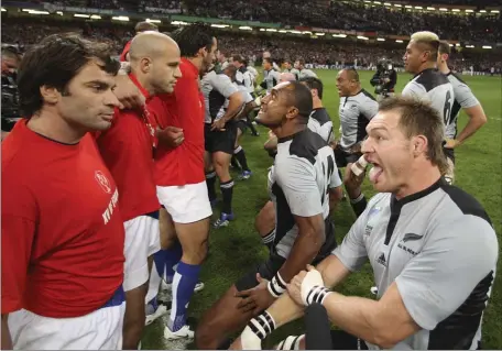  ?? ROSS LAND — THE ASSOCIATED PRESS FILE ?? French players, left, stand close to their New Zealand counterpar­ts who perform their pre-match Haka before the Rugby World Cup quarterfin­al match between France and New Zealand at the Millennium Stadium in Cardiff, Wales, on Oct. 6, 2007. New Zealand rugby teams have been performing the haka before matches for 135 years.