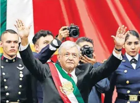  ?? [AP PHOTO] ?? Mexico’s new President Andres Manuel Lopez Obrador greets the crowd at the end of his inaugural ceremony at the National Congress on Saturday in Mexico City.