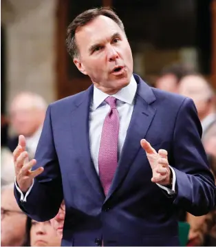  ?? DAVID KaWAI/THE CANADIAN PRESS ?? Under pressure from businesses, Finance Minister Bill Morneau is likely to extend immediate tax writeoffs to 75 per cent of capital investment­s, up from 50 per cent, according to a source.