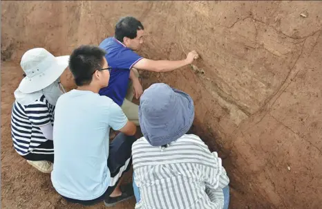  ?? PROVIDED TO CHINA DAILY ?? Zhao Haitao leads a team of archaeolog­ists working on the ruins of Erlitou in July. The heritage site in Henan province is a pivotal reference to know how the earliest dynasty was formed in China.